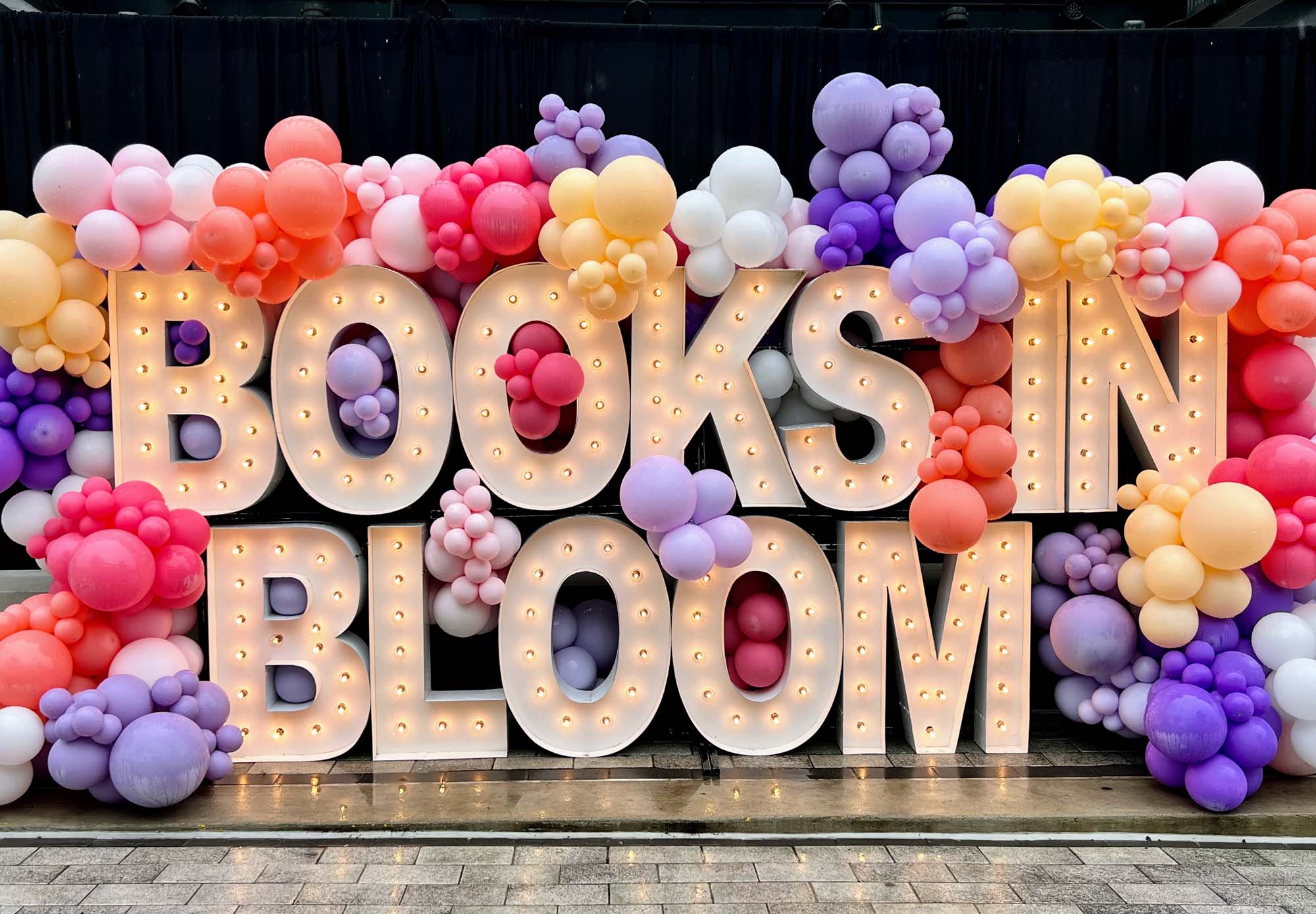 Books in Blooms sign with balloons